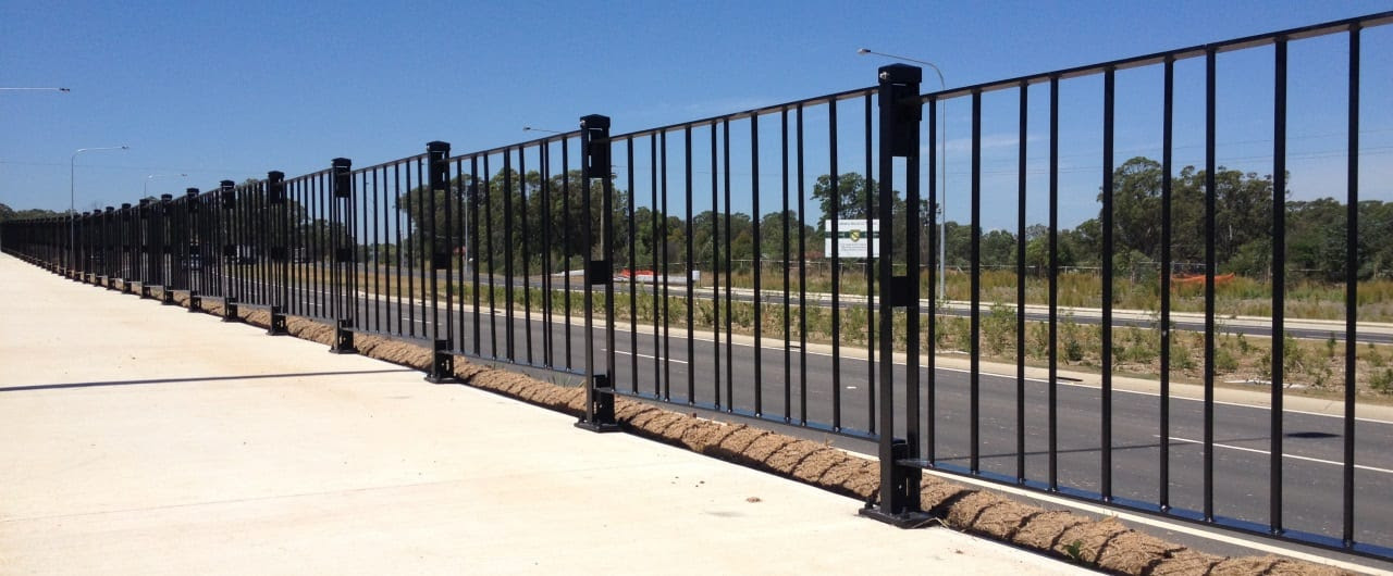Metal crowd control barriers for pedestrian safety at an event.
